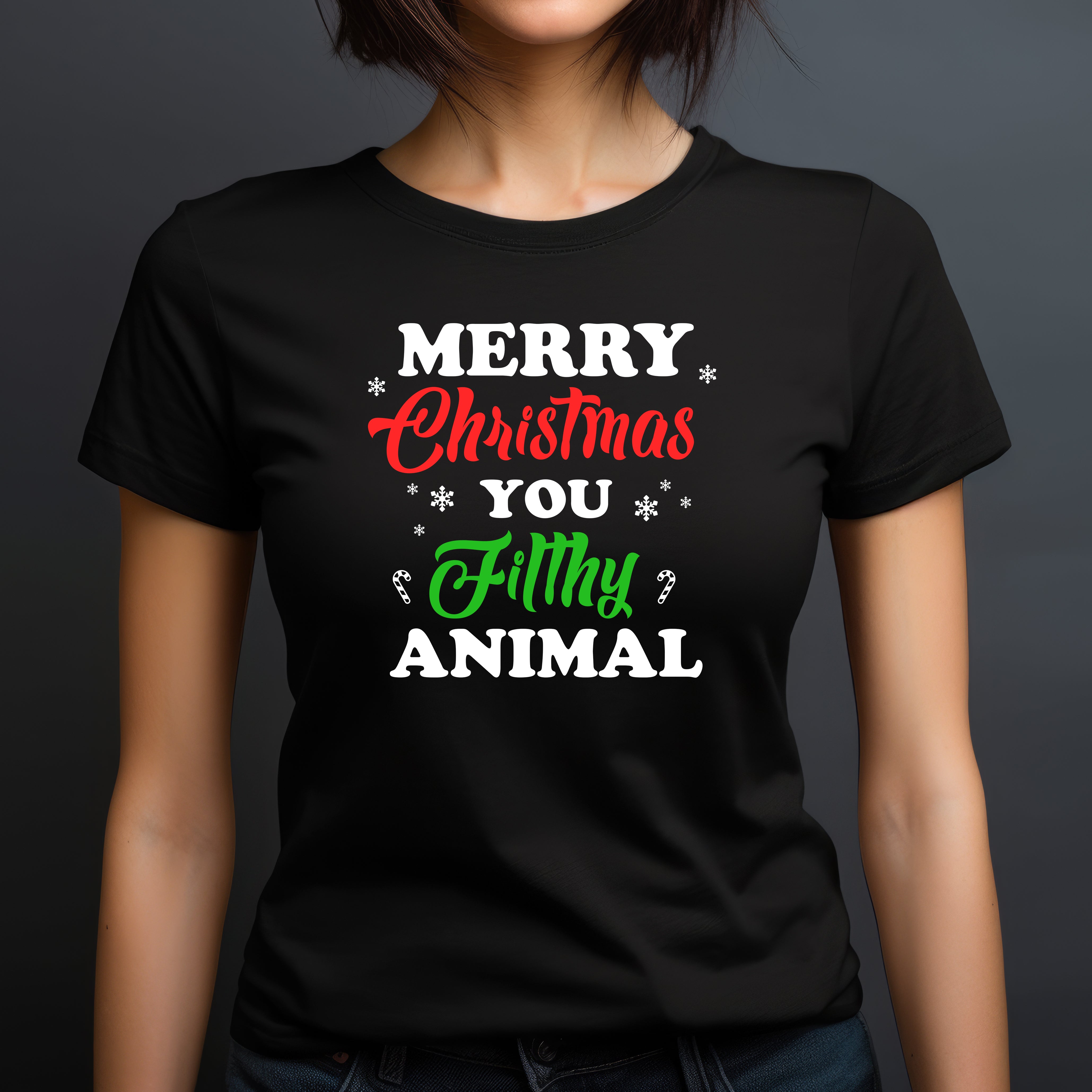 Woman in black crewneck t-shirt with Merry Christmas You Filthy Animal text in holiday colors