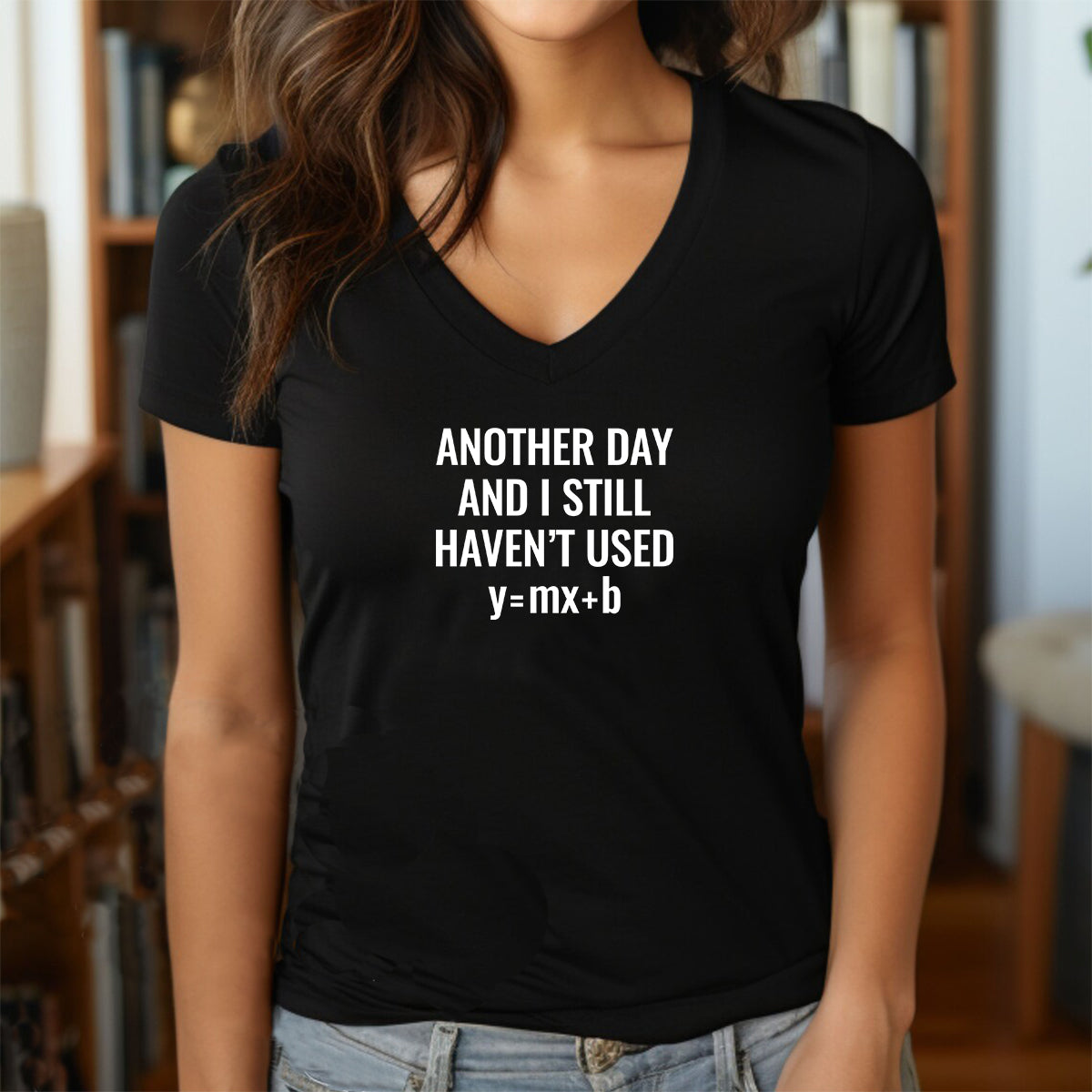 Grey women’s v-neck t-shirt with bold math joke text Another Day and I Still Haven’t Used y=mx+b