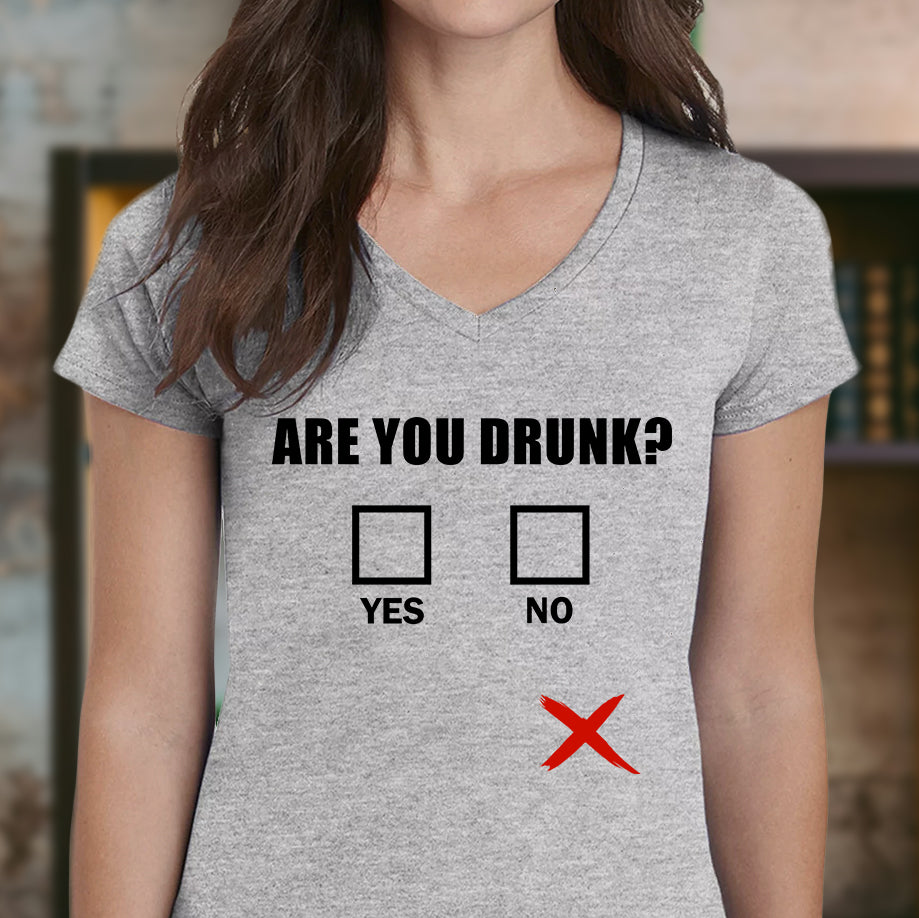 Woman wearing grey v-neck shirt with Are You Drunk text and off-center red X checkbox design