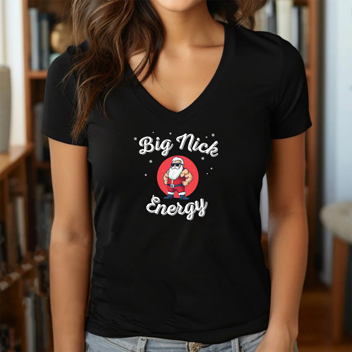 Woman wearing v-neck Big Nick Energy Santa t-shirt with cartoon muscular Santa in festive style