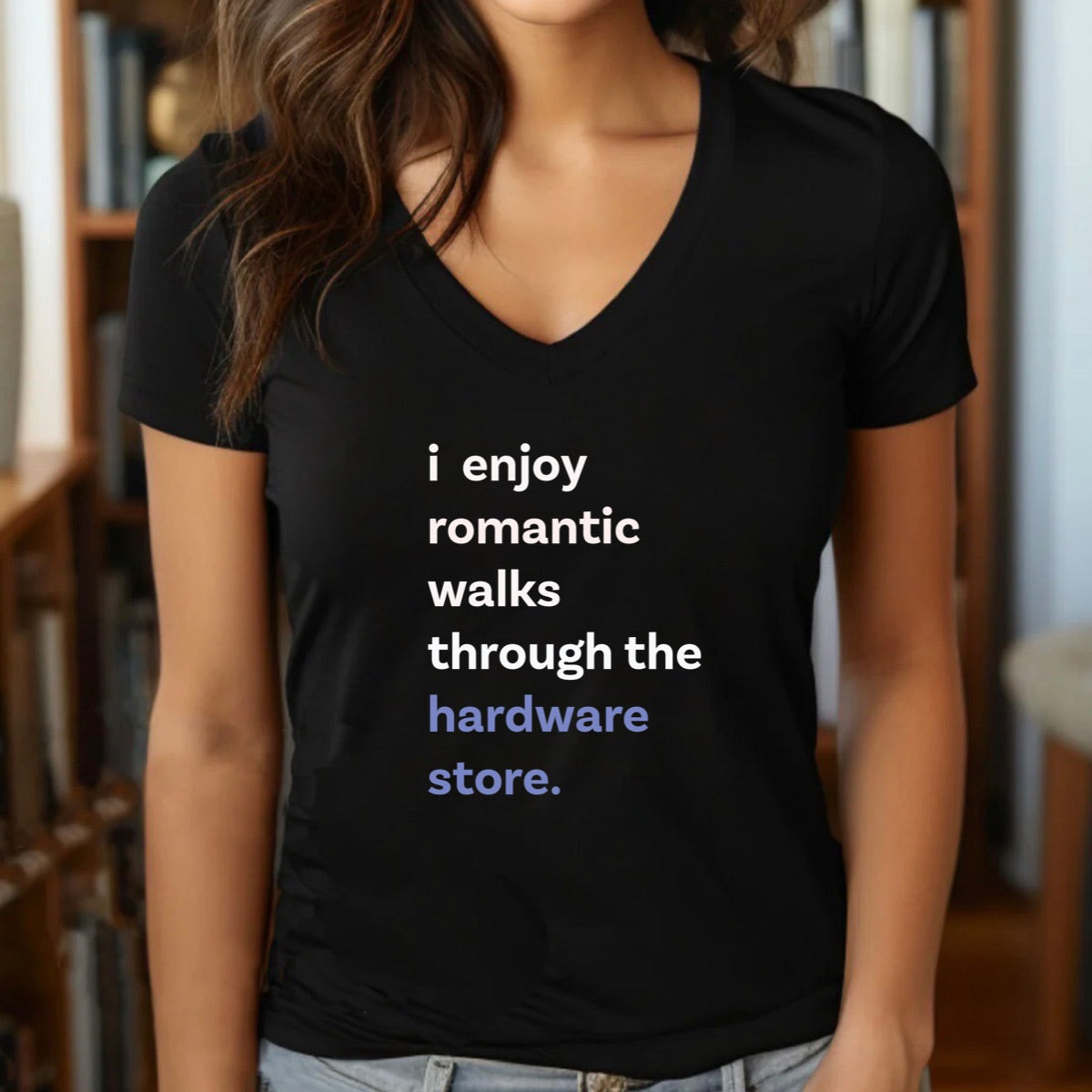 Woman in v-neck black t-shirt with text i enjoy romantic walks through the hardware store in white and blue