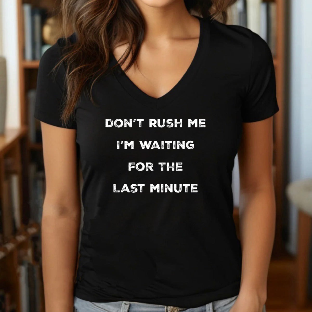 Woman wearing black v-neck procrastination shirt with white text saying don't rush me I'm waiting for the last minute