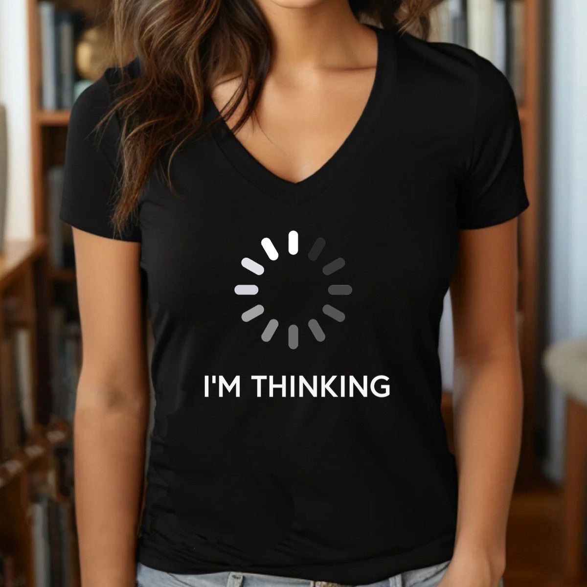 Woman wearing black v-neck t-shirt with loading symbol and I'm Thinking text in white