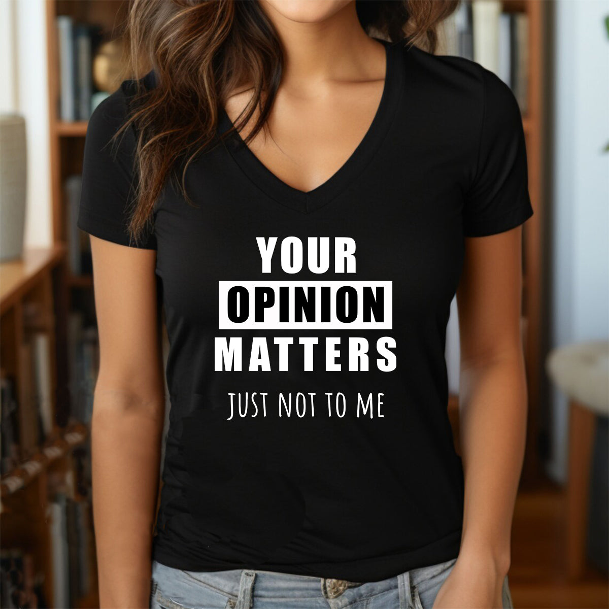 Woman wearing black v-neck t-shirt with sarcastic phrase Your Opinion Matters Just Not To Me in bold white letters