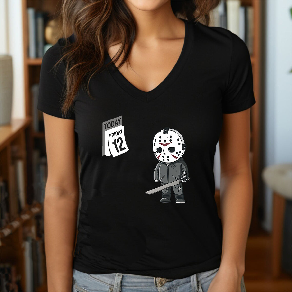 Woman in black V-neck Halloween shirt with cartoon Jason Voorhees and Friday the 13th calendar print