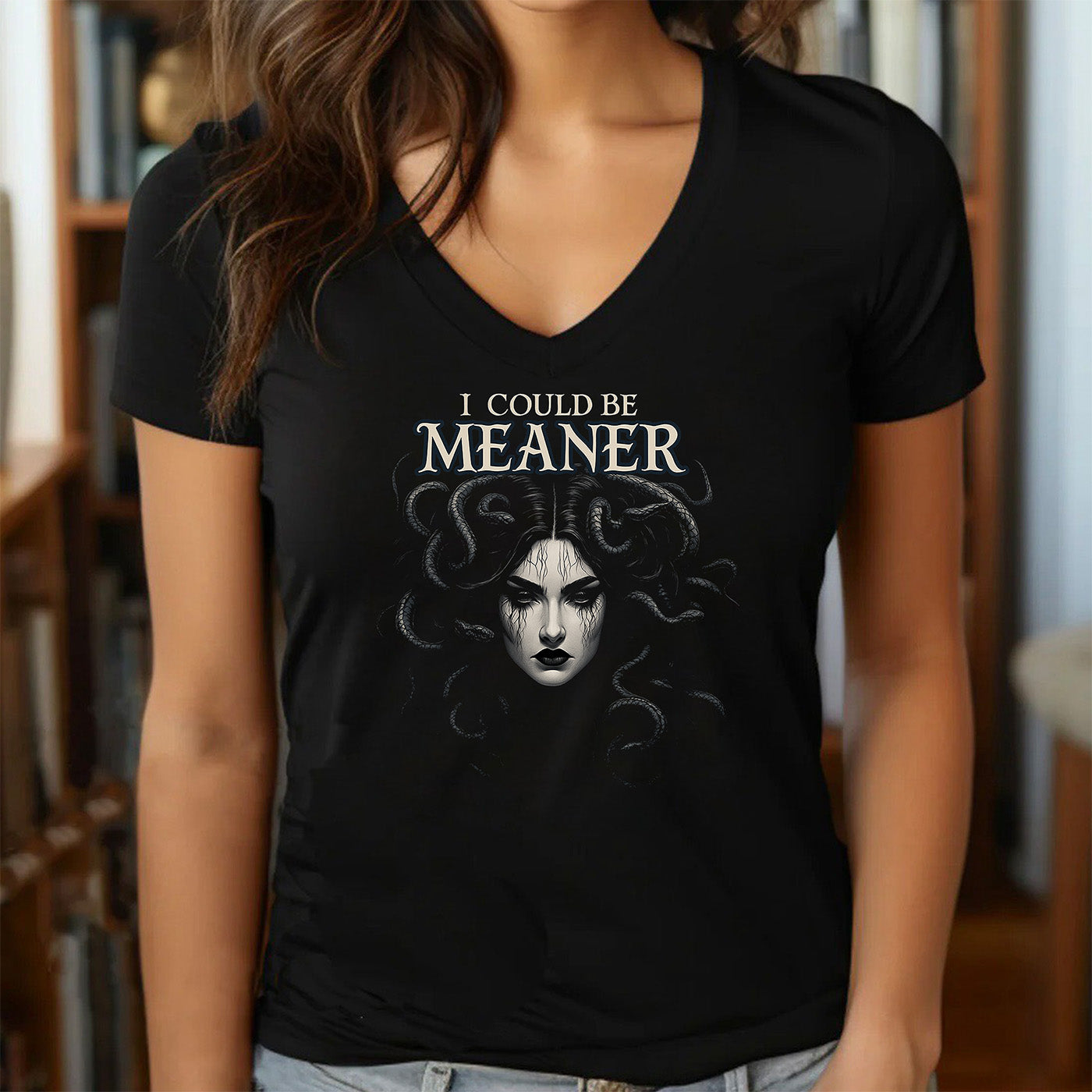 woman in v-neck black t-shirt with dark medusa graphic and saying i could be meaner