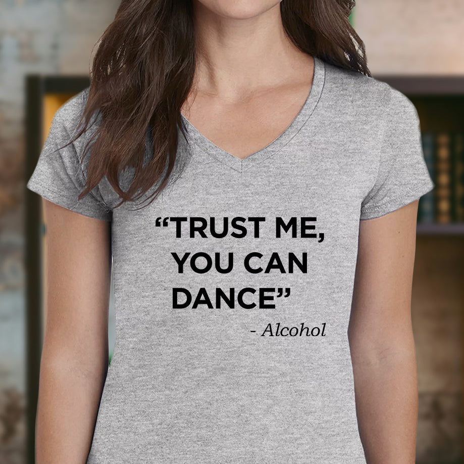 Woman in a black V-neck T-shirt featuring the text “Sarcasm is my love language” with flower details.