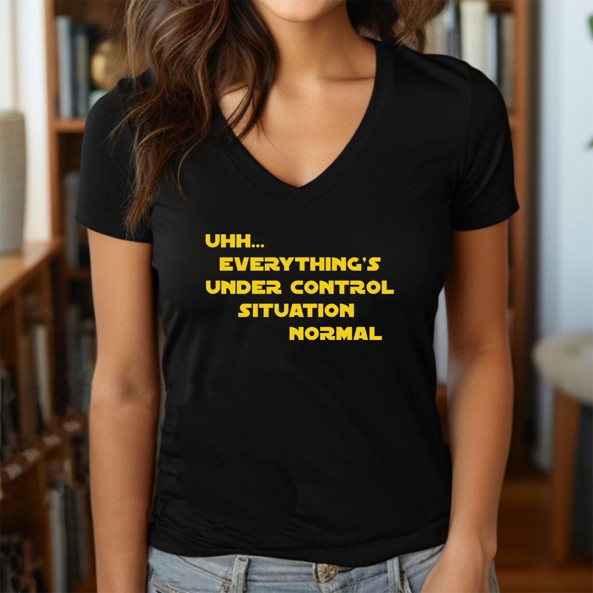 Woman wearing black v-neck geeky Star Wars quote t-shirt with yellow text situation normal under control