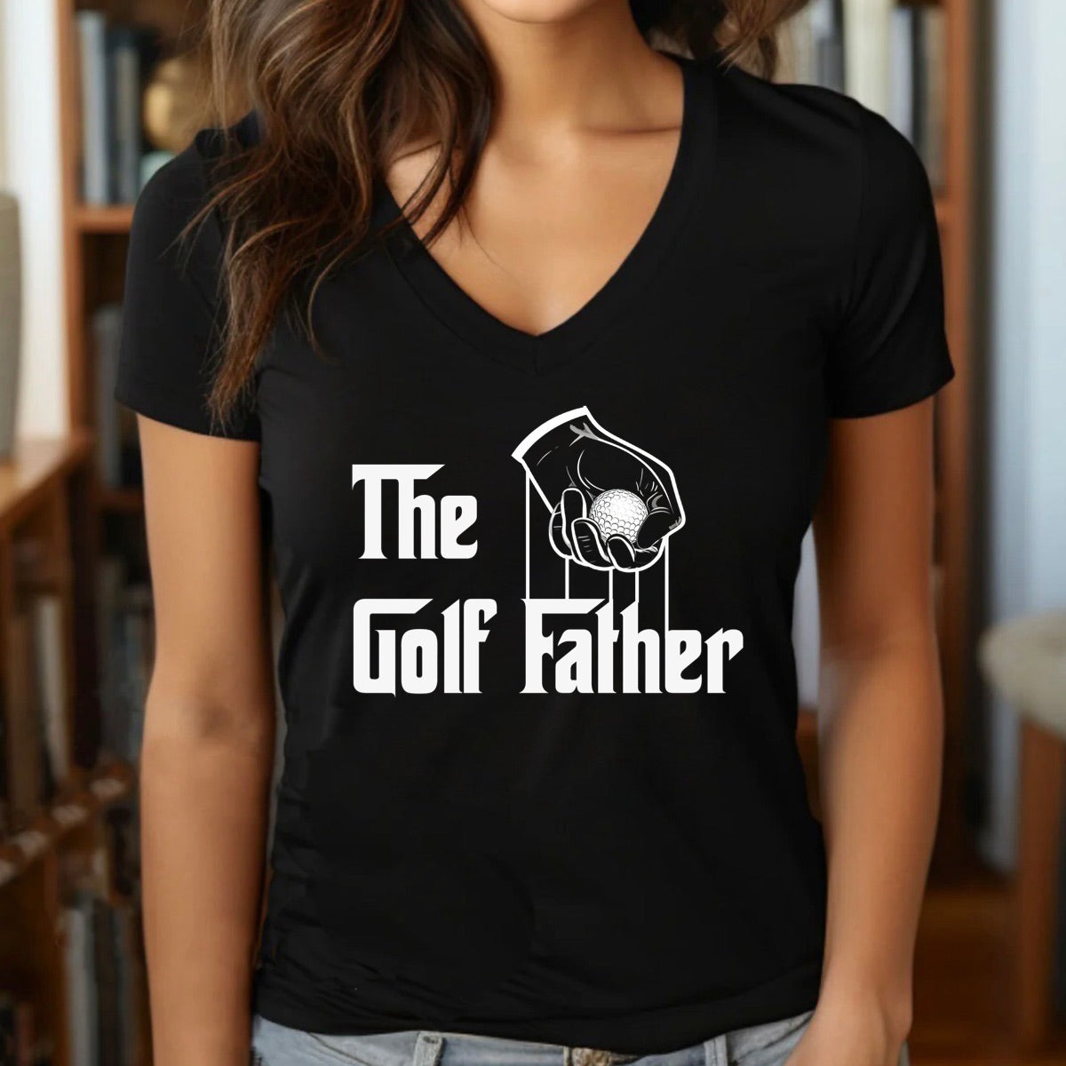Woman wearing black v-neck The Golf Father t-shirt with funny golf ball hand design