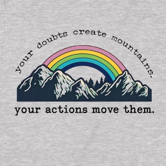 Closeup of rainbow and mountain graphic with quote your doubts create mountains, your actions move them on heather gray tee